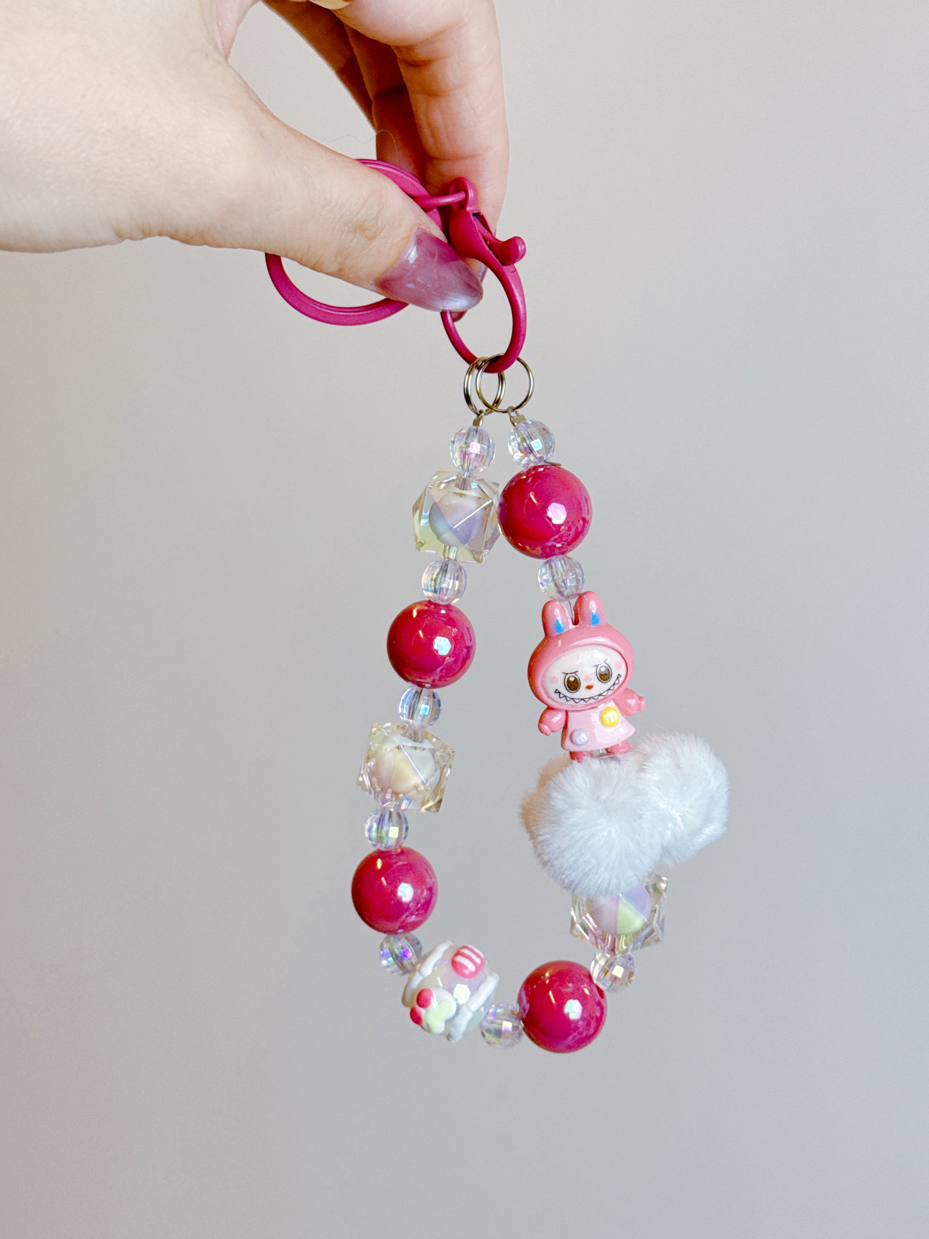 Labubu Phone Chain – Beaded Wrist Strap with Fluffy Pom-Pom & Resin Mini-Doll Charm